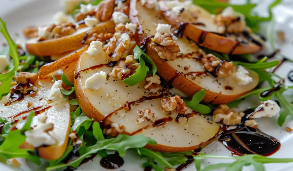 Pear Salad with Walnuts topped with goat cheese and balsamic